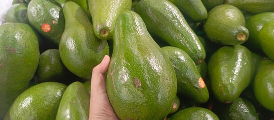 fresh and tantalizing cluster of avocados