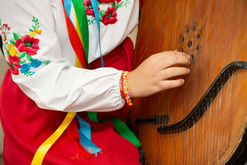Bandura is a Ukrainian folk stringed plucked musical instrument. A classical (diatonic) and modern (diatonic or chromatic) instrument from the harp, gusel, and psaltery family.