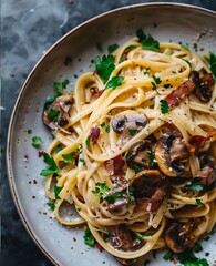 Indulgent creamy fettuccine pasta with savory mushrooms and crispy bacon, garnished with fresh parsley.