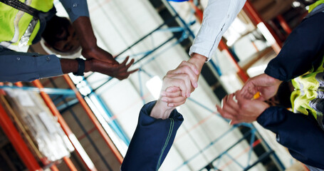 Business people, handshake or logistics with applause for partnership or distribution in storage. Low angle, employees or colleagues shaking hands with deal for shipping or supply chain in depot