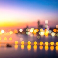 Blurred city lights reflect over water, soft focus sunset