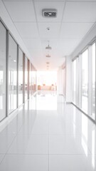 Gleaming office hallway; natural light floods from end