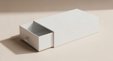 A close-up image of a white rectangular box with an open drawer, casting a shadow on a beige surface. The box has a small pull