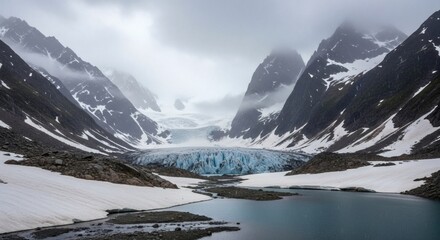 Glacier surrounded by snow-capped mountains and a lake beneath a cloudy sky
