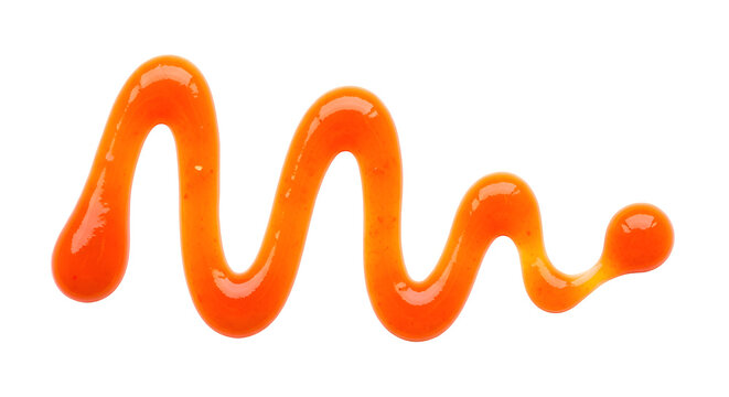 Orange sauce squiggle on black background swirl drip