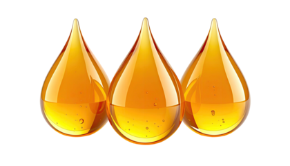 Three glistening golden drops suspended against black