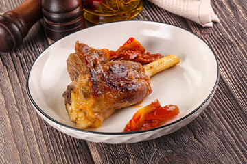 Baked lamb shank with vegetables