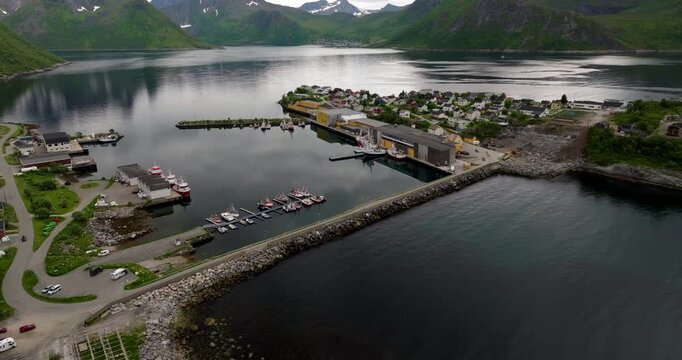 Causeway between Senja and quaint fishing village of Husoy island, Norway. Drone