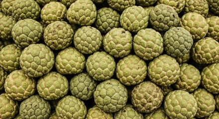 Obraz premium Abundant Texture of Fresh Green Custard Apples Stacked Together