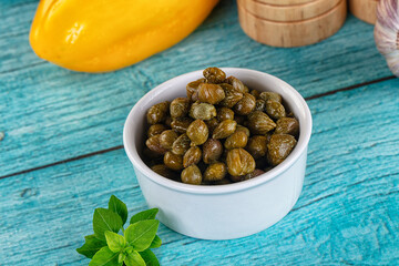 Pickled canned capers in the bowl