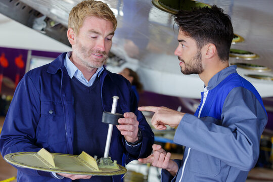 male aero engineer carrying out check in hangar