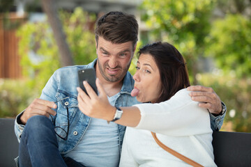Fototapeta premium happy couple taking selfie photo with a smart phone