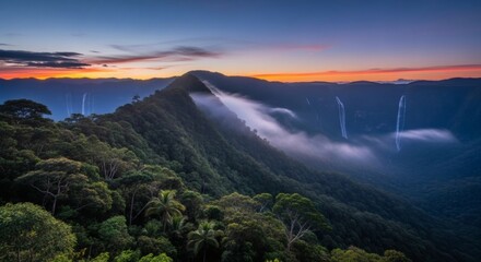 Serene panoramic view of lush, verdant mountain range at dusk, with cascading waterfalls and ethereal mist