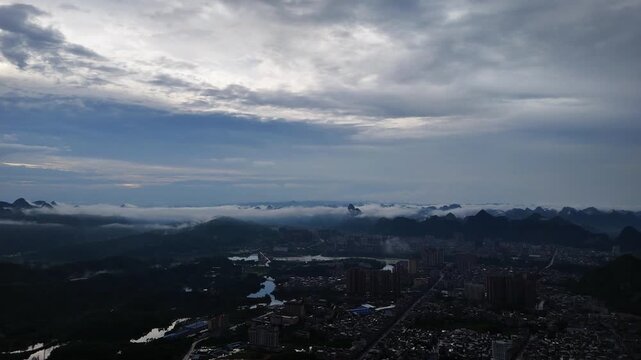  Golden Sunshower Over Mountain City with Distant Mist, Aerial Drone View, China