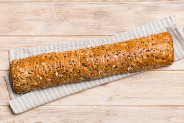 fresh crunchy french baguette on colored table. Top view Bakery products
