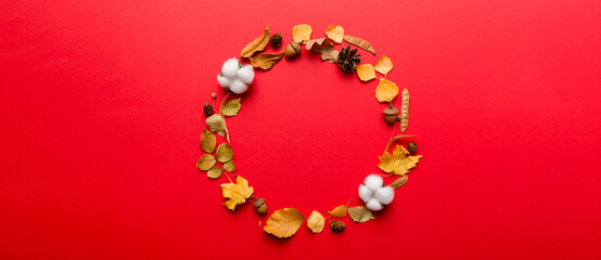 Autumn composition made of dried leaves, cones and acorns on table. Flat lay, top view