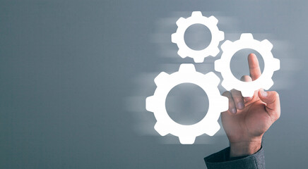 Businessman and blue gear icon on screen. Concept of the mechanism