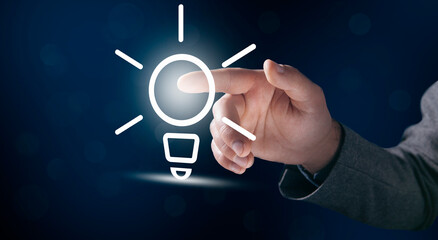 Businessman and light bulb on screen, concept idea