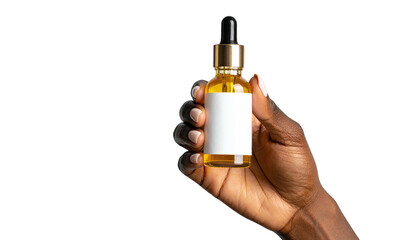 Hand holds amber oil bottle with blank label on dark backdrop