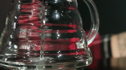 Experienced barista fills coffee dripper with hot water. Woman uses device to strain water presenting process of making coffee slow motion