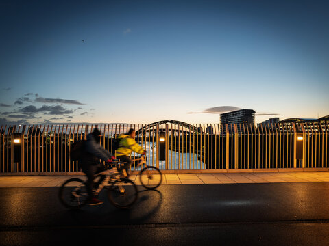 Cyclists crossing Keel Crossing at sunrise