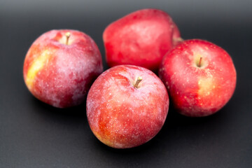 red apples on a black background