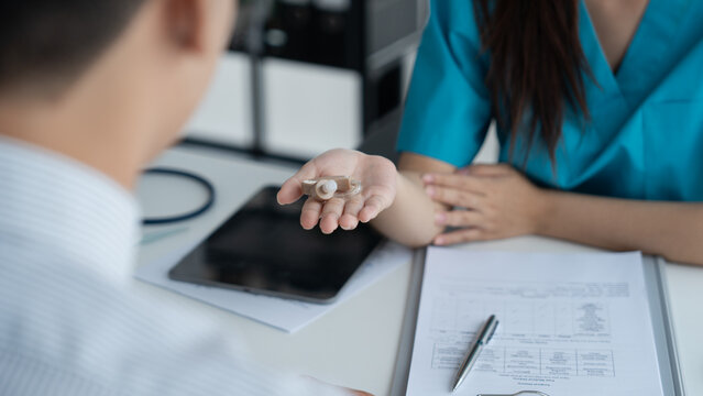 Doctor recommended hearing aids to hearing impaired person