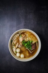fish maw soup in a white bowl
