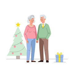 Elderly couple smiling together in front of Christmas tree with gifts  