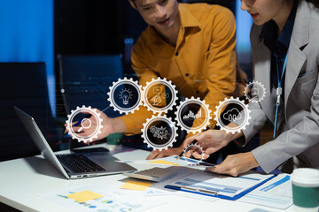 project manager working overtime on startup planning, updating progress milestones, and collaborating with investors for business success.