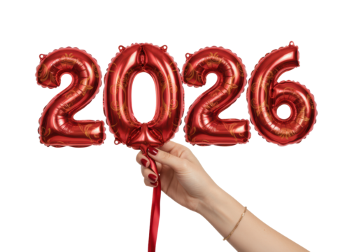 Person hand holding red gold balloon with festive charm