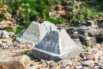 Dragon's teeth are concrete pyramids used as anti-tank obstacles, first introduced in World War II to block tanks and mechanised infantry on the North Atlantic coast of Scotland