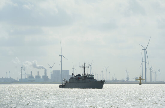 Minehunter protecting Eemshaven harbour during NATO exercise with wind turbines