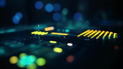 Pulsing audio mixing console displaying LED level meters in dark studio, with faders bokeh lights - Powered by Adobe