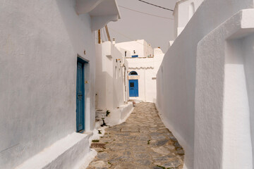 The street with a typical architecture of Greek style whitewashed houses in Chora village, Amorgos island, Cyclades, Greece