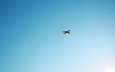 Airplane flying in the blue sky,panoramic view. High quality