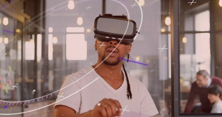 Navigating augmented reality developer wearing VR headset in coworking space with sticky notes