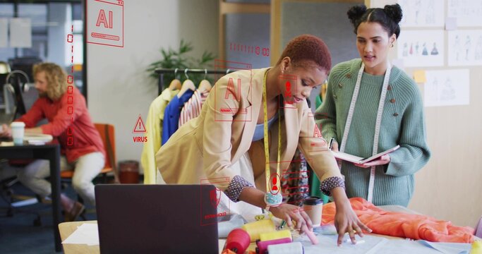 Collaborating two fashion designers examining fabric in fashion design studio with thread spools