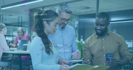 Collaborating three professionals inspecting code overlay at office desk, with tablet and folder