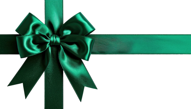 Emerald silk ribbon bow, crossed on a dark, flat surface