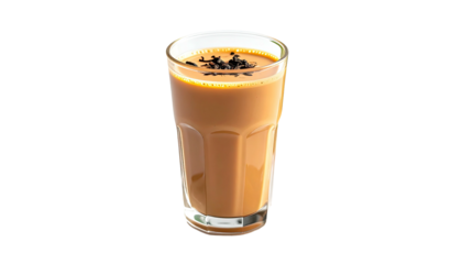 Full glass of chai tea with floating tea leaves