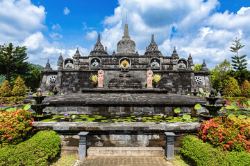 Temple at the Buddhist temple Brama Vihara Aram in northern Bali, Indonesia, a miniature version of Borobudur, the famous Buddhist temple in Java. 
