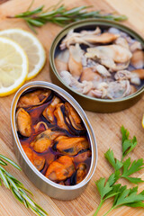 Cans of preserve with lemon and differents herbs