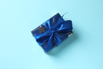 Festive blue gift on color background
