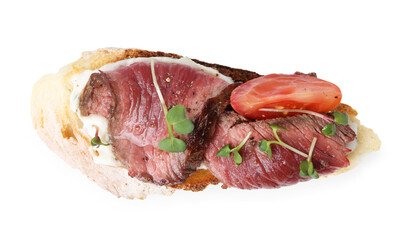 Delicious bruschetta with roast beef, cream cheese, tomato and microgreens isolated on white, top view