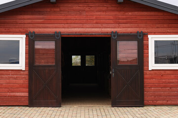 Wooden barn with open doors on farm © New Africa