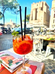 Aperol Spritz cocktail served at an outdoor café in Rome, Italy © Svetoslav Sokolov