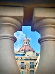 Historic dome view framed by balustrade in Valletta, Malta