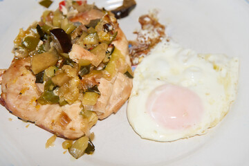 Prepared chicken breast with vegetables and fried egg