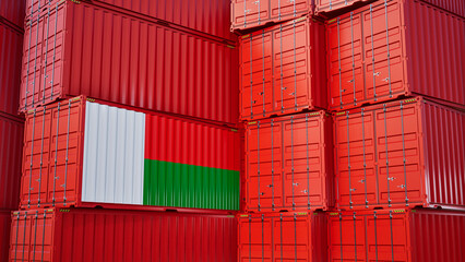 Fototapeta premium Cargo shipping container with madagascar flag, shipping and freight transportation of madagascar concept.